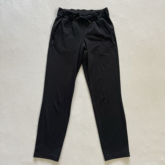 Lululemon Women Solid Black On the Fly 7/8 Drawstring Luxtreme Travel Pant 2 - Picture 1 of 7